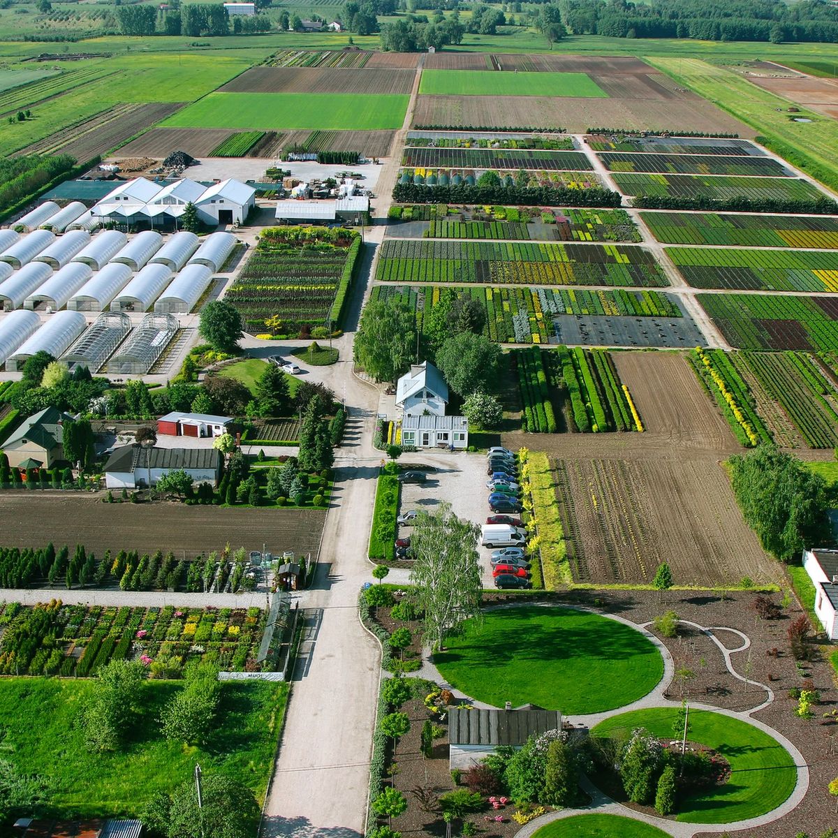 Expansive, modern farm landscape with vibrant fields and technology
